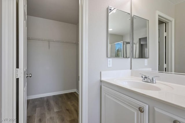 bathroom with hardwood / wood-style flooring and vanity