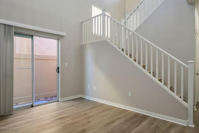 stairs featuring wood-type flooring