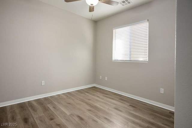 spare room featuring ceiling fan and wood-type flooring