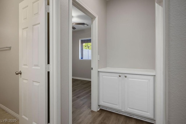 corridor featuring dark wood-type flooring