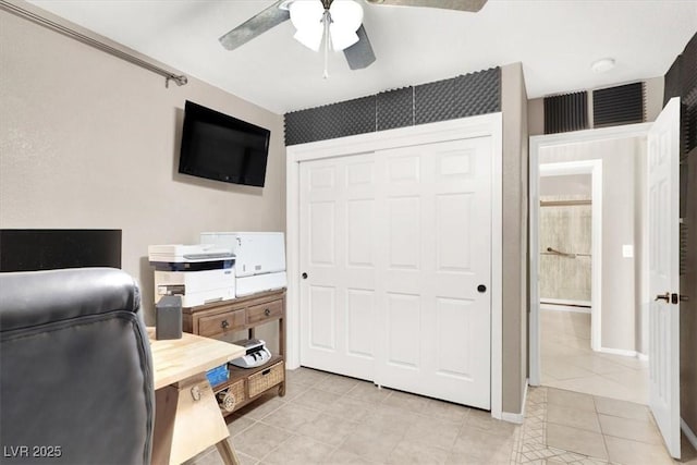 office area featuring light tile patterned floors and ceiling fan