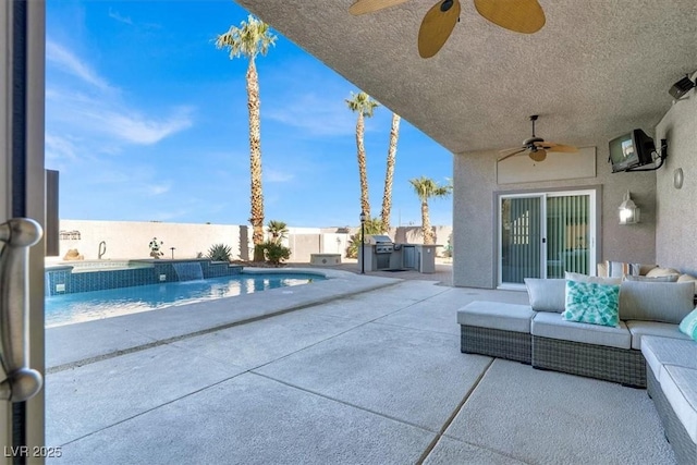 view of swimming pool featuring exterior kitchen, a grill, ceiling fan, and a patio area