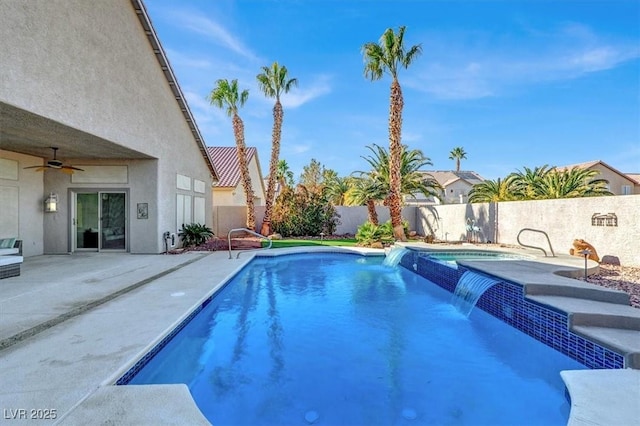 view of pool with pool water feature, ceiling fan, and a patio area