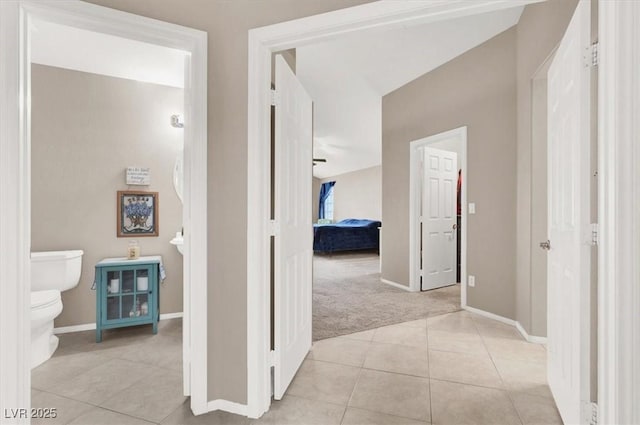 hall featuring light tile patterned floors