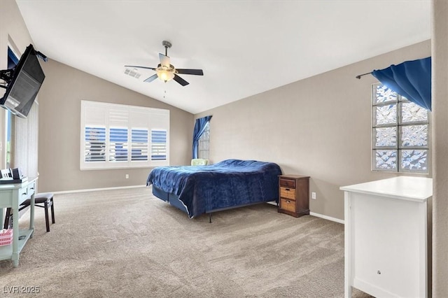 carpeted bedroom with ceiling fan and lofted ceiling