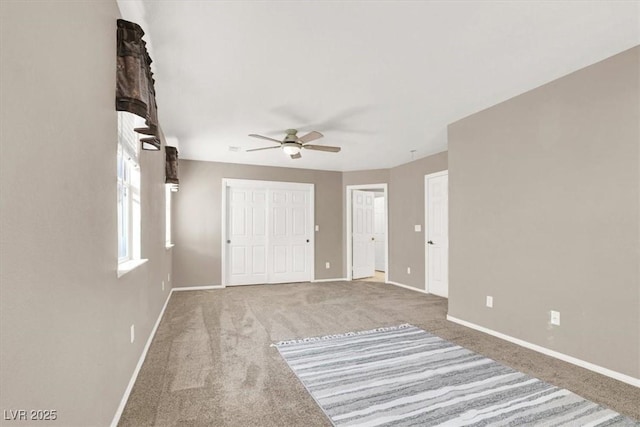 unfurnished room featuring carpet floors and ceiling fan