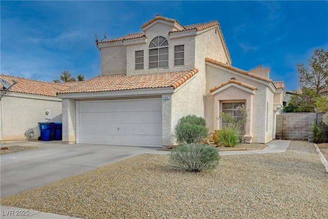 mediterranean / spanish-style home featuring a garage