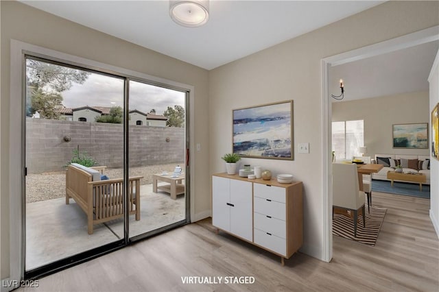 doorway to outside with light hardwood / wood-style flooring