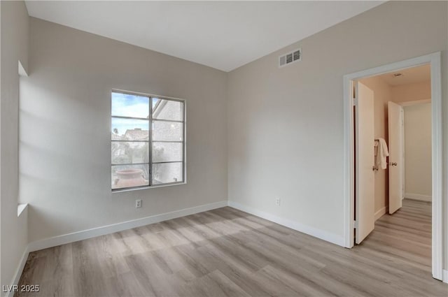 empty room with light wood-type flooring