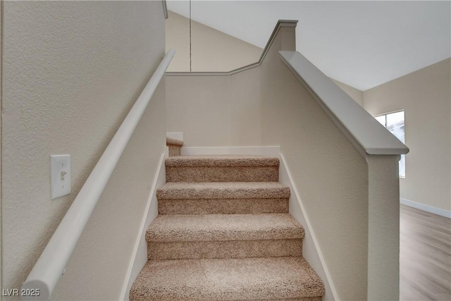 stairway featuring wood-type flooring