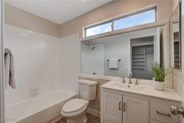 full bathroom with vanity, bathing tub / shower combination, and toilet