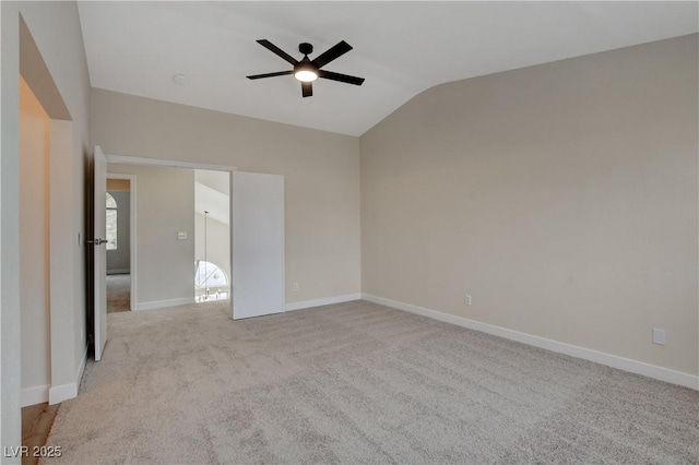 unfurnished bedroom featuring ceiling fan, light colored carpet, and lofted ceiling