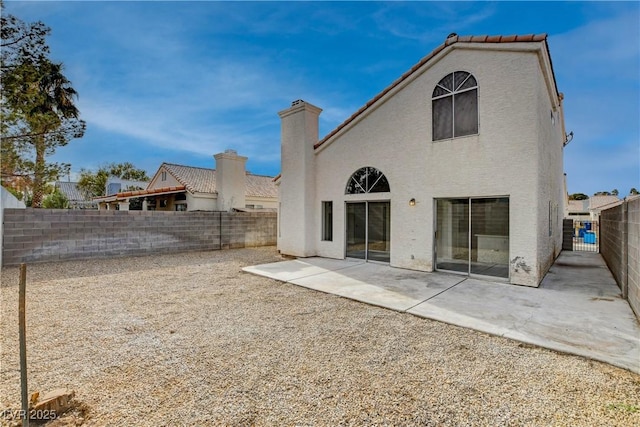 rear view of house with a patio area