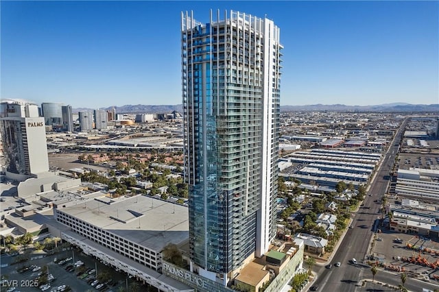 property's view of city with a mountain view