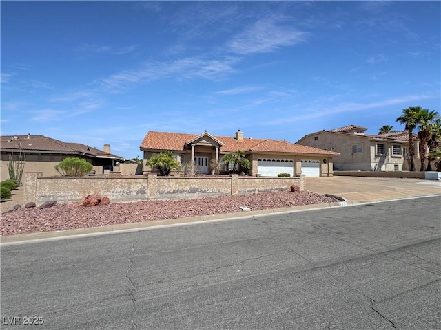 ranch-style house featuring a garage