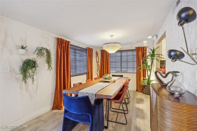 dining room with light wood-type flooring