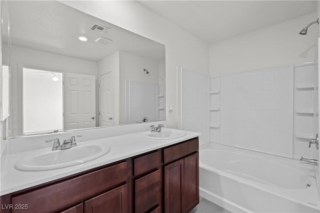 bathroom with vanity and bathtub / shower combination