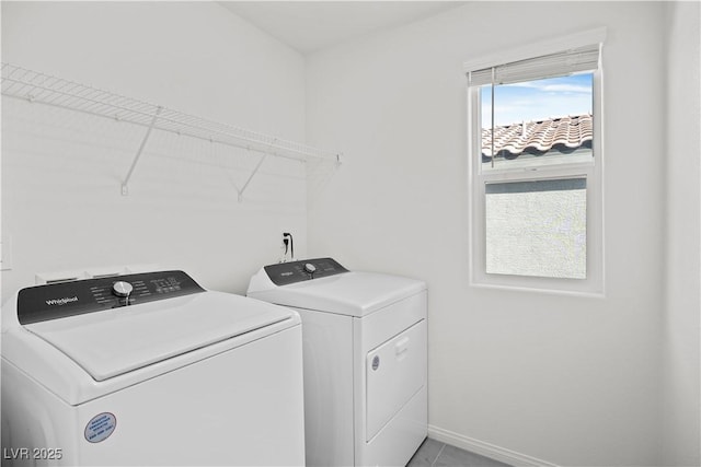 laundry area featuring washing machine and clothes dryer