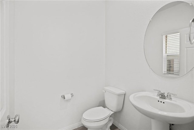 bathroom featuring sink and toilet