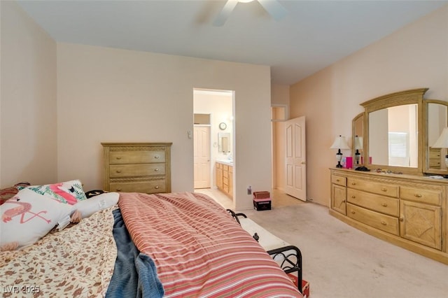 carpeted bedroom featuring ceiling fan and ensuite bathroom