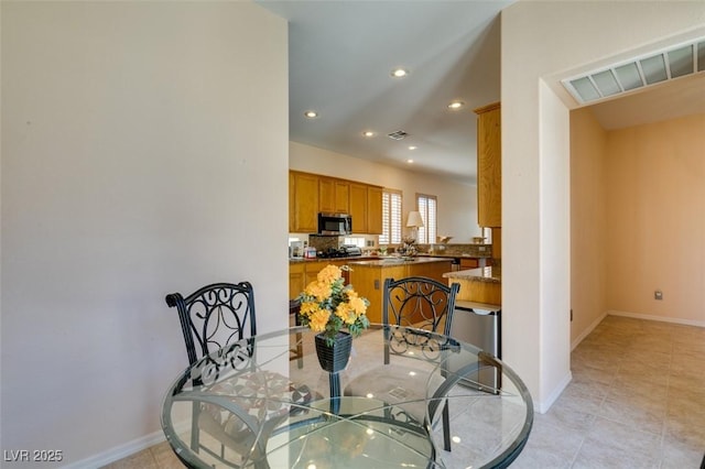 dining space with light tile patterned flooring