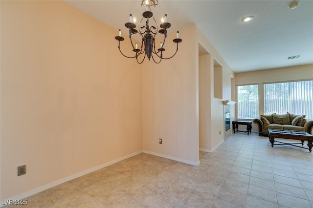 interior space with an inviting chandelier and light tile patterned flooring