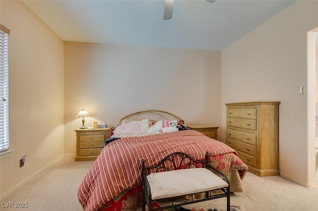 bedroom with ceiling fan and light colored carpet