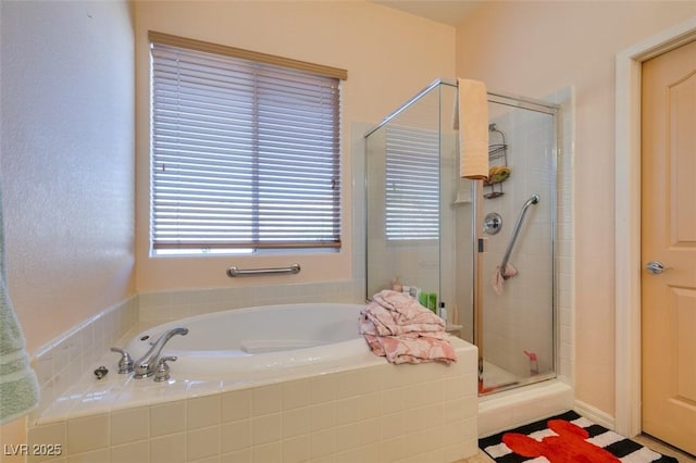 bathroom featuring separate shower and tub