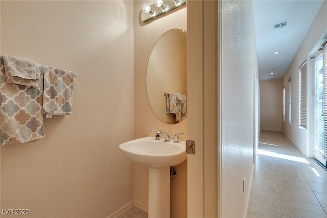 bathroom featuring tile patterned flooring and sink