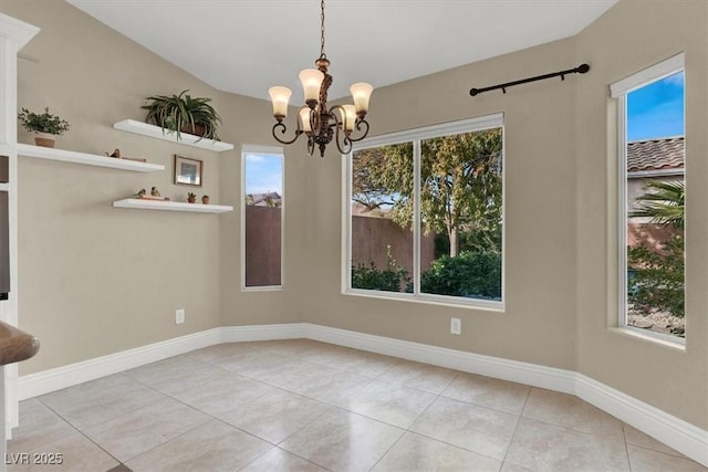 unfurnished dining area featuring light tile patterned flooring and a notable chandelier