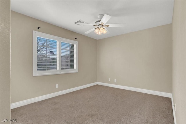 carpeted empty room featuring ceiling fan