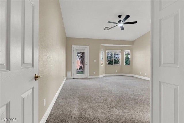 carpeted empty room featuring ceiling fan