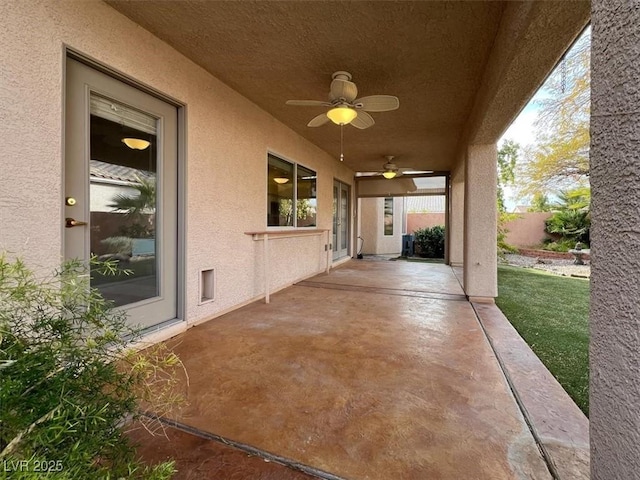 view of patio / terrace featuring ceiling fan