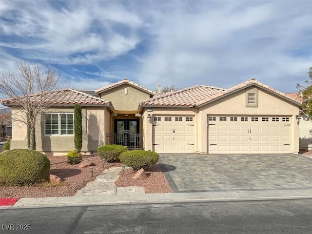 mediterranean / spanish-style home featuring a garage