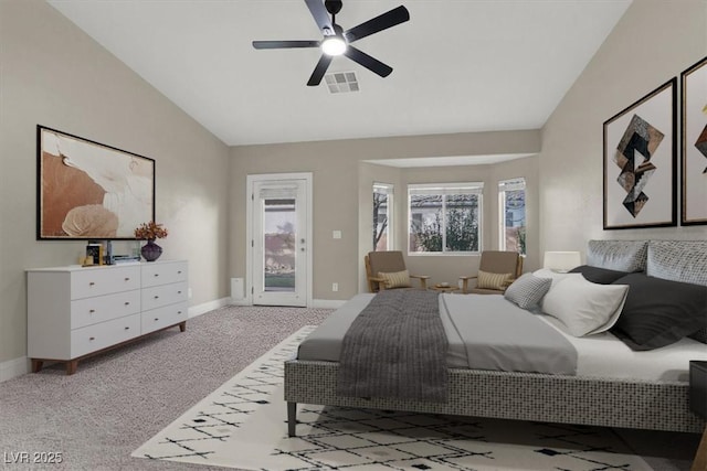 bedroom featuring light carpet, access to exterior, lofted ceiling, and ceiling fan