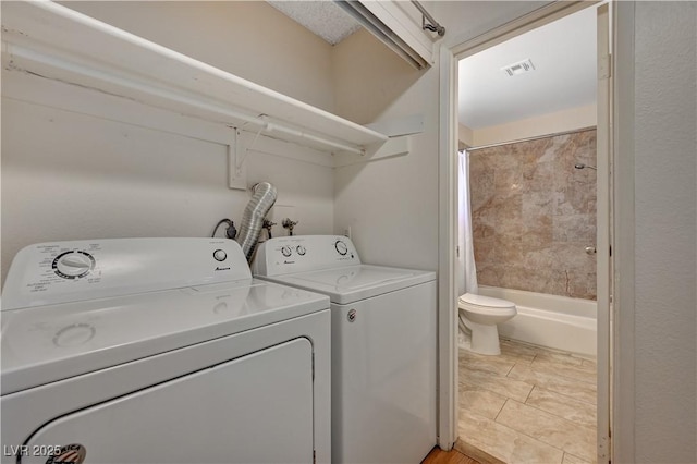 laundry area featuring washing machine and dryer