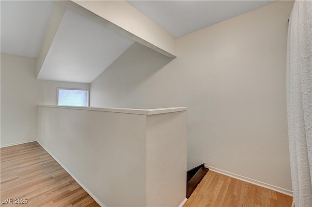 hallway with light hardwood / wood-style flooring