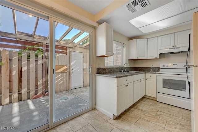 kitchen with white cabinetry, sink, light tile patterned floors, and white range with electric stovetop