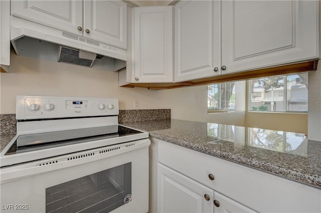 kitchen featuring white electric stove, light stone countertops, and white cabinets