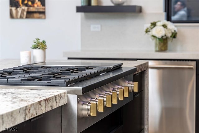 details featuring light stone counters and stainless steel appliances