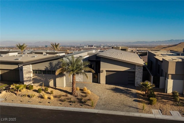 view of front of home featuring a garage and a mountain view