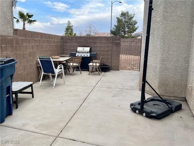 view of patio with a grill