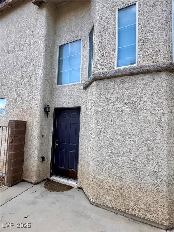 doorway to property with a patio