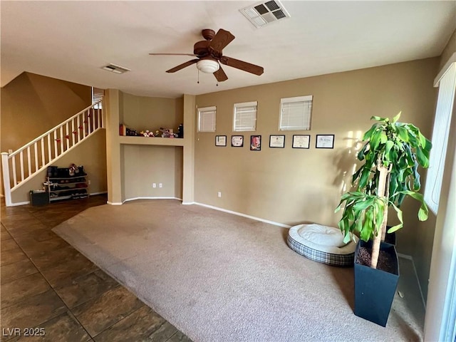 living area featuring ceiling fan