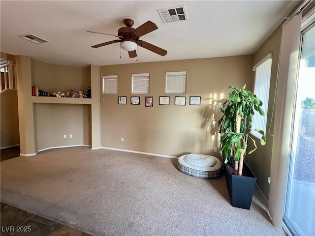 unfurnished room with carpet floors and ceiling fan