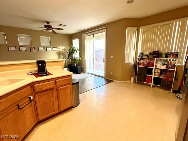 kitchen with ceiling fan and sink