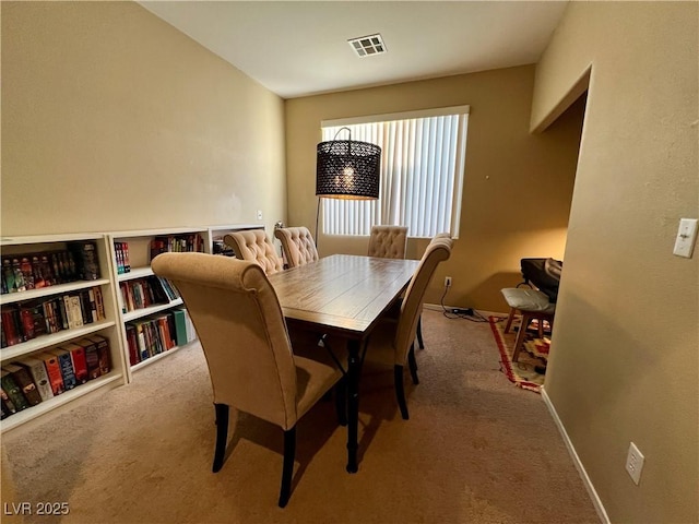 view of carpeted dining space