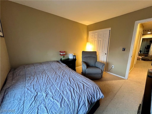 bedroom with light colored carpet