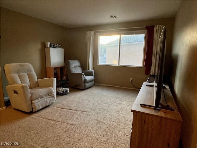 living area featuring carpet floors