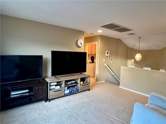 living room with lofted ceiling and light carpet